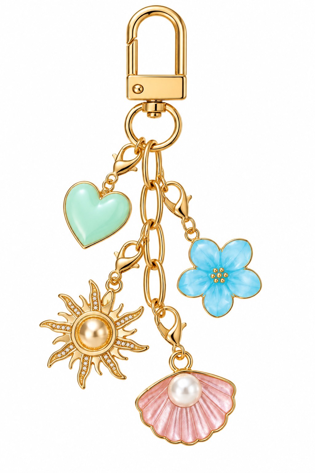 The gold Oaiscents Signature Keychain with all four charms clipped on: mint heart, blue flower, gold sun and pink shell